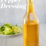 roasted red pepper dressing in front of salad