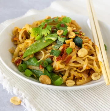 pad thai noodles with peanuts on side