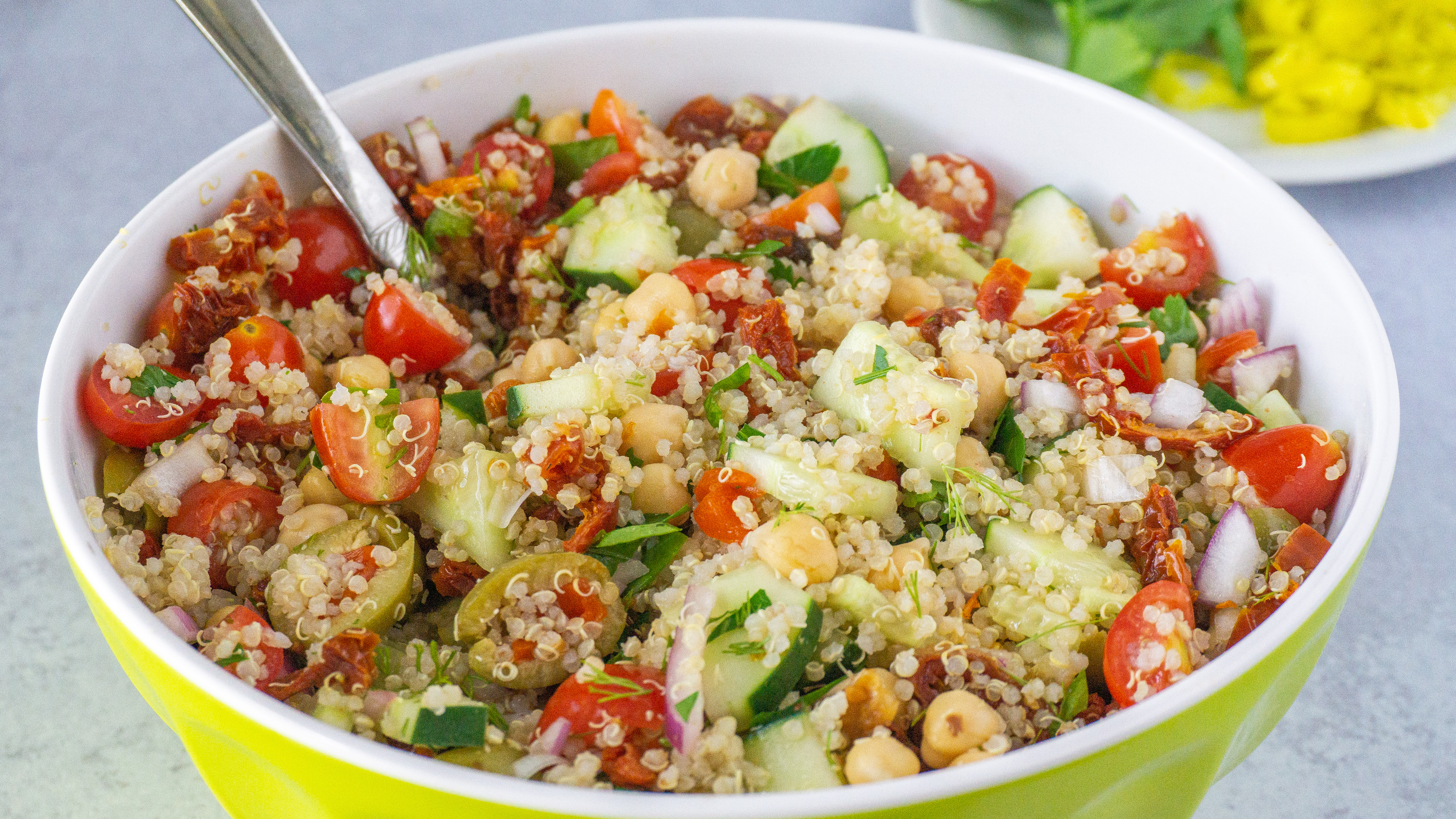 greek quinoa salad with tons of colorful veggies and olives