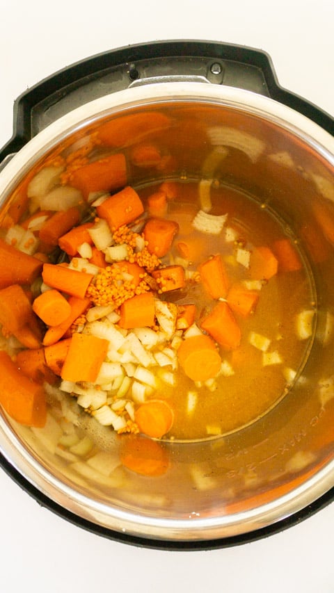 ingredients in instant pot for the carrot lentil soup