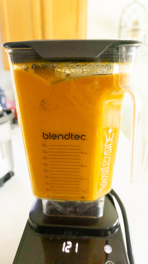 carrot lentil soup blending in a blender