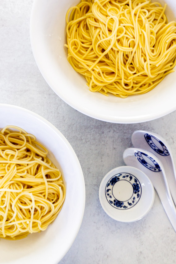 ramen noodles divided between bowls