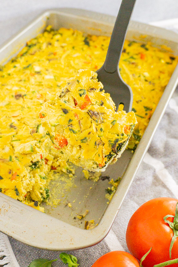 spatula scooping a serving of this vegan hash brown casserole