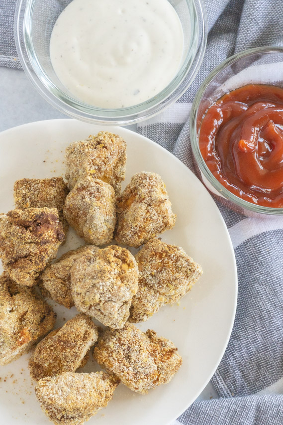 vegan air fryer tofu nuggets with dipping sauces on side