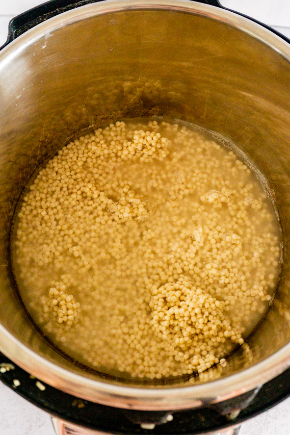 place couscous and broth in the instant pot with salt to taste
