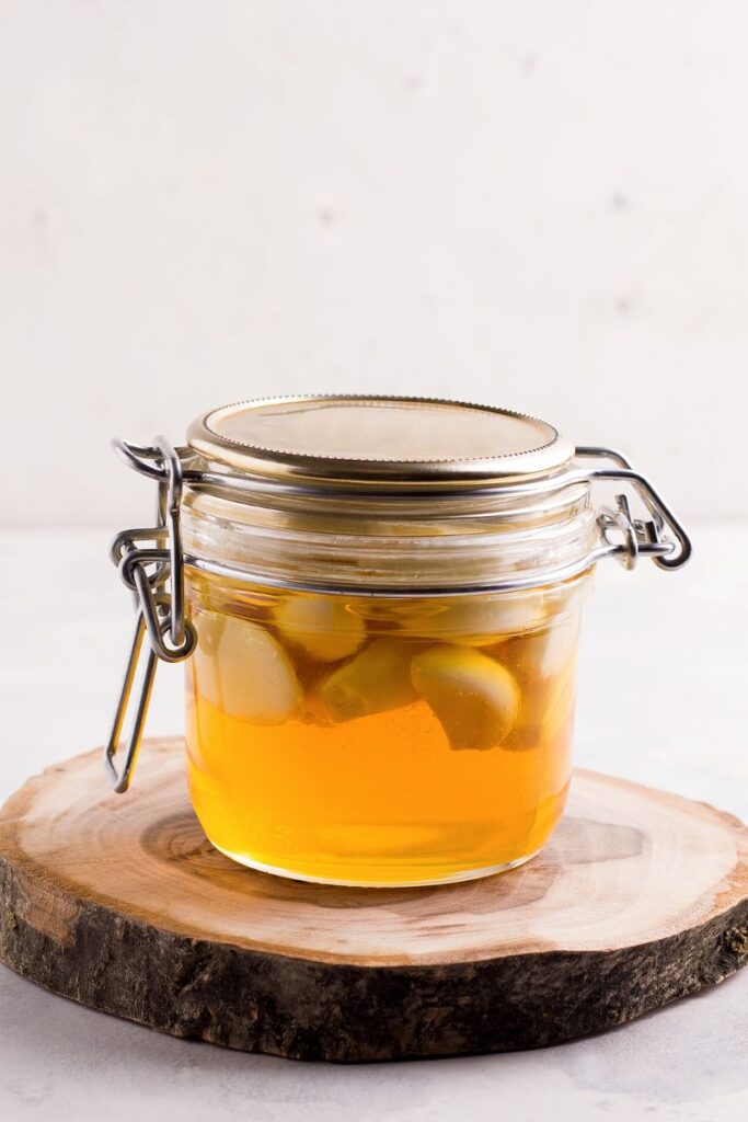 honey and garlic in a jar
